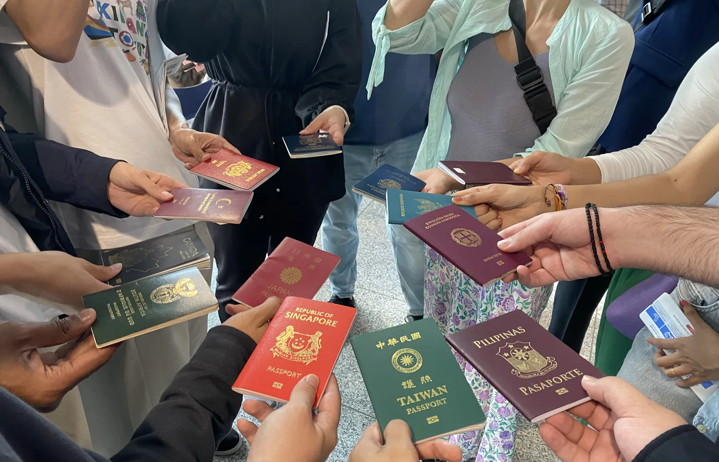 Travellers holding passports during journey planning